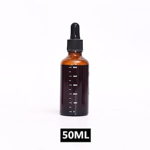 May include: A brown glass bottle with a black dropper top. The bottle has a clear liquid inside and markings on the side indicating milliliters. The bottle is labeled "50ML".