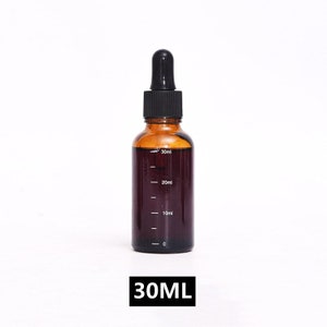 May include: A 30 ml amber glass bottle with a black dropper top. The bottle has a clear graduated scale with markings for 10 ml, 20 ml, and 30 ml.