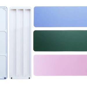 May include: Overhead view of white plastic organizers and three rectangular mats in blue, green, and pink. The organizers are rectangular with compartments. The mats are solid colours.