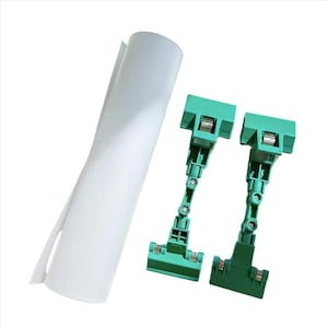 May include: A roll of white paper and two green adjustable sign holders are displayed against a white background. The sign holders have a clip at the top and bottom, with an adjustable arm.