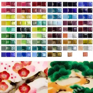 May include: A collection of small square glass tiles in a wide variety of colours, including shades of red, blue, green, yellow, and metallic tones, arranged in a grid, alongside two detailed illustrations of floral and pine tree motifs.