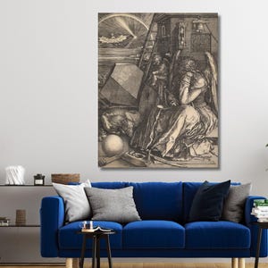 May include: A black and white wall art print featuring Albrecht Dürer's Melencolia I engraving. The detailed artwork depicts a winged figure sitting in contemplation amidst various symbolic objects, including a polyhedron, sphere, and hourglass.