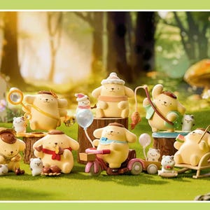 May include: A collection of yellow cartoon character figurines in various poses, some with accessories like a magnifying glass, bow and arrow, and a tricycle. The figurines are set in a whimsical outdoor scene with a house and trees.
