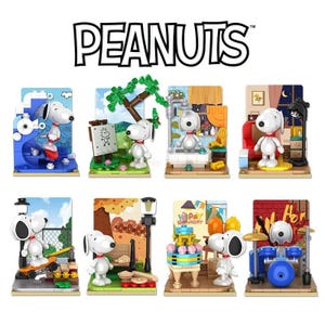 May include: A set of eight Peanuts character building blocks. Each block features a different scene with a Peanuts character, including Snoopy, Woodstock, and Charlie Brown. The blocks are made of colourful plastic and are designed for children aged 3 and up.