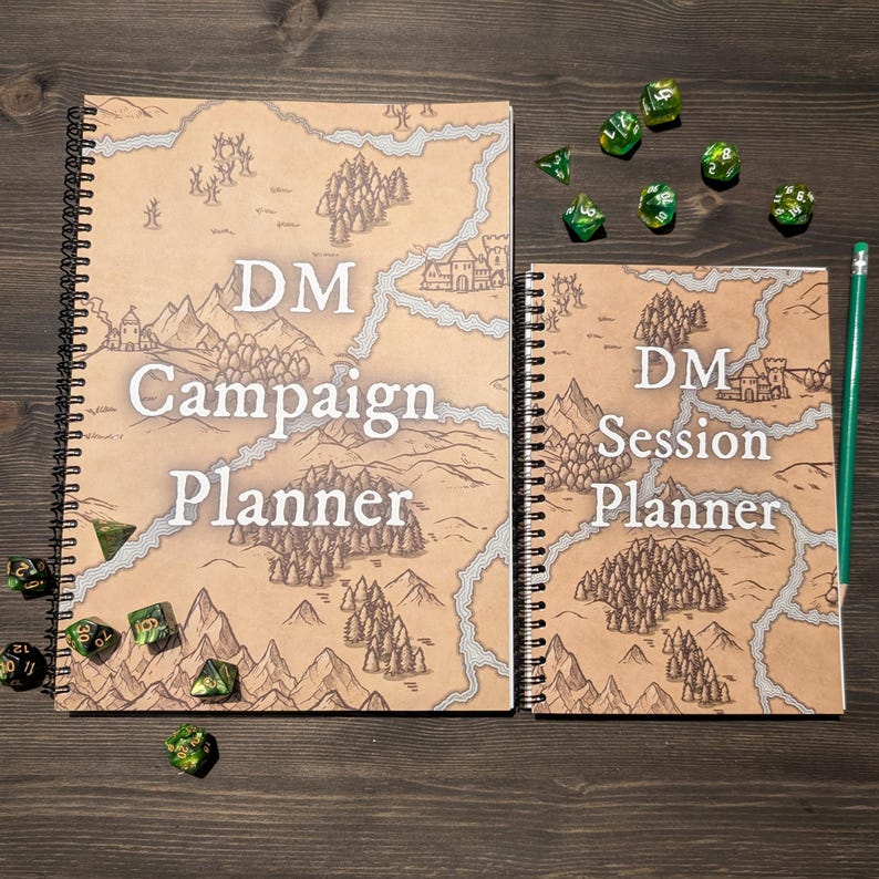 May include: Two spiral bound notebooks with brown covers and a map design. The larger notebook says "DM Campaign Planner" and the smaller notebook says "DM Session Planner". Both notebooks have green dice scattered around them.