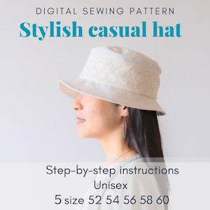 Könnte beinhalten: Ein weißer Casual-Hut mit einer Spitzenborte. Der Hut ist unisex und in fünf Größen erhältlich: 52, 54, 56, 58 und 60. Das Bild enthält den Text "Stylish casual hat" und "Step-by-step instructions".