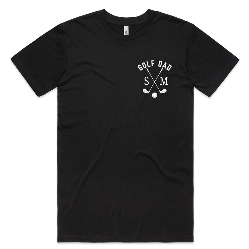 May include: Black t-shirt with a white graphic of crossed golf clubs and the text "Golf Dad" with the initials "S & M" underneath.