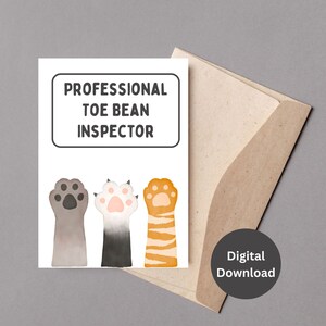May include: A greeting card with the text "PROFESSIONAL TOE BEAN INSPECTOR" above three watercolor cat paws. The paws are gray, black and white, and orange and white. The card is inside a brown envelope with a "Digital Download" sticker.
