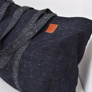 Big market bag of lightweight fabric, Extra large grocery bag, Denim high capacity shopper, Reusable oversize tote for sustainable shopping - side view of high capacity