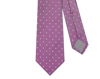 May include: A purple tie with a white polka dot pattern.