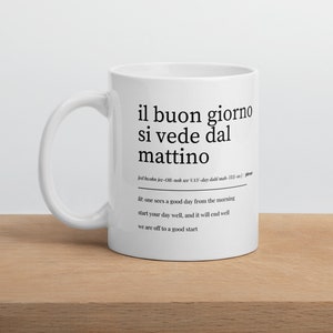 close-up of motivational italian phrase mug on white shirt