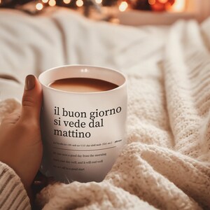 cozy morning scene with italian sayings coffee mug in bed