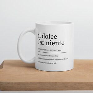 lifestyle image of italian coffee mug with motivational phrase il dolce far niente