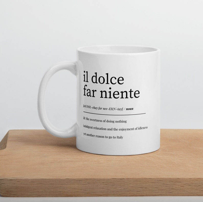 lifestyle image of italian coffee mug with motivational phrase il dolce far niente