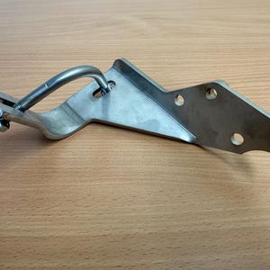 Saab 900 exhaust support bracket.