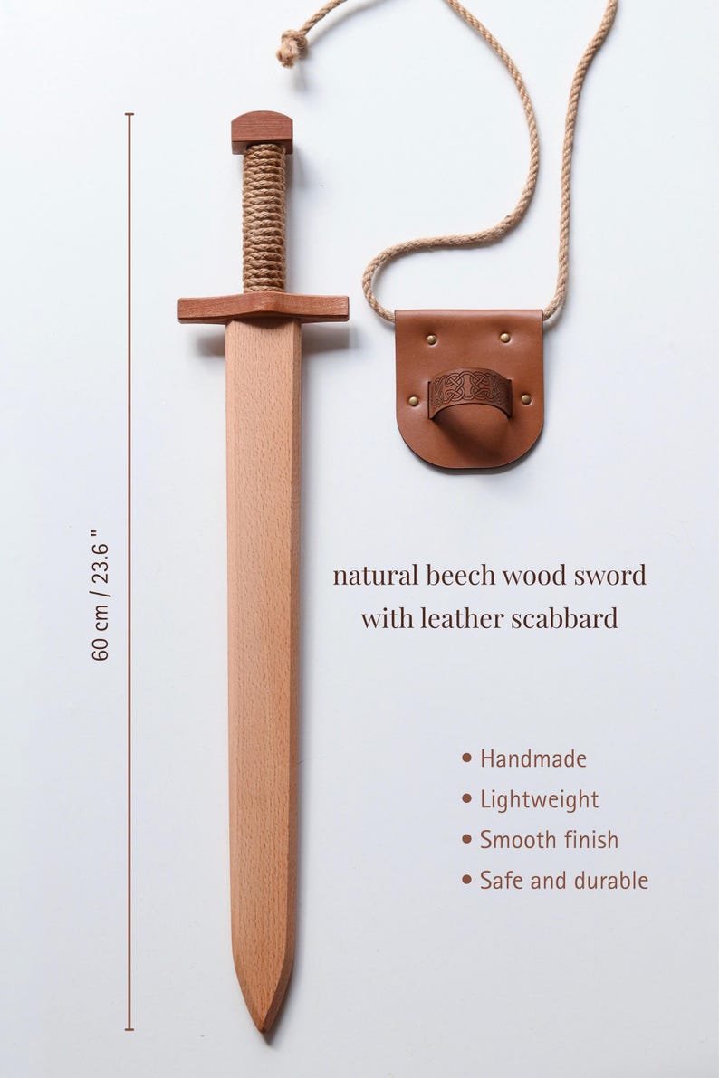 May include: A natural beech wood sword with a rope-wrapped handle and a leather scabbard featuring a rope strap. The sword measures 23.6 inches in length. Text on the image reads: natural beech wood sword with leather scabbard, Handmade, Lightweight, Smooth finish, Safe and durable.