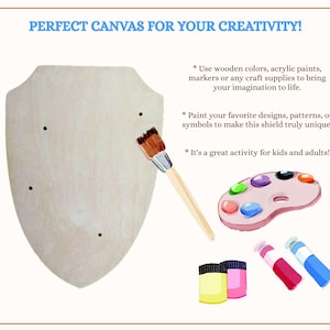 May include: A light-coloured wooden shield cutout with four small holes, a paintbrush, a paint palette with colourful paint blobs, and tubes of yellow, pink, red, and blue paint. Text reads: PERFECT CANVAS FOR YOUR CREATIVITY!
