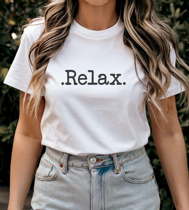 May include: White t-shirt with the text "Relax." printed in black.