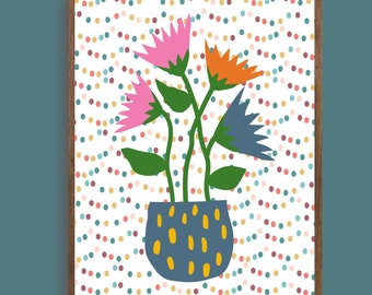 May include: A framed print of a colorful floral illustration with a blue pot on a white background with a confetti pattern. The flowers are pink, orange, and blue.