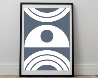 May include: A framed print with a geometric design featuring overlapping circles in shades of blue and white.