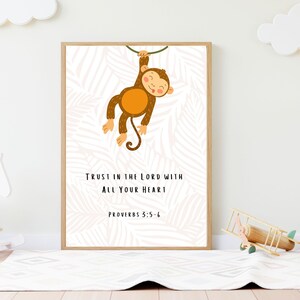 May include: A printable wall art design featuring a cartoon monkey hanging from a vine with a pink and white tropical leaf background. The text reads "Trust in the Lord with all your heart, Proverbs 3:5-6".