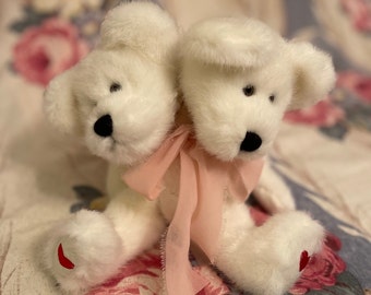 White 2 headed bear with red heats on their feet