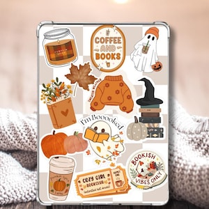 May include: A clear tablet case adorned with fall-themed stickers. The stickers include a pumpkin spice latte, pumpkins, a ghost, a sweater, and the phrases "Coffee and Books", "I'm Booooked", and "Cozy Girl Bookclub". The background is a checkered pattern.