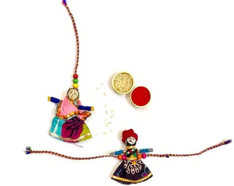 Beautiful Puppet Rakhi pair for Bhai and Bhabhi  with Complementary Roli Chawal