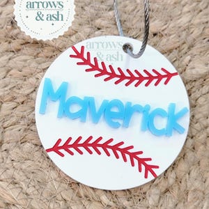 May include: A white ceramic mug with a black handle and the text "But First, Coffee" in a bold, black font. The mug is set against a neutral background, highlighting its simple design.