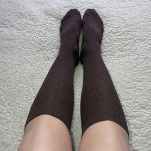May include: A pair of brown ribbed knee-high socks.