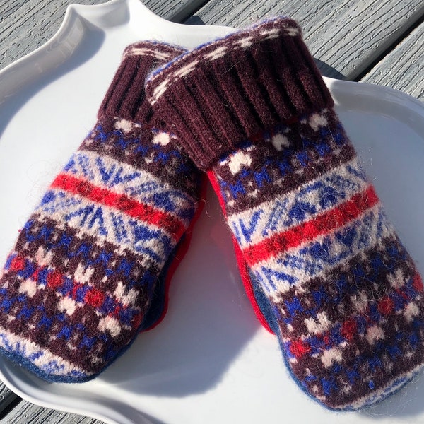 Upcycled wool sweater mittens with fleece lining.