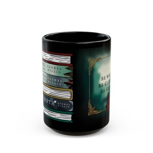 May include: Black ceramic mug featuring a stack of books with titles and author names. The mug also displays the text "Be Wise, Be Clear, Be Good" in a decorative frame. A unique gift for book lovers.