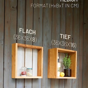 K&ouml;nnte beinhalten: Zwei Holz-Wandregale, eines flach und eines tief, mit den Ma&szlig;en "36x36x8" und "36x36x16" in Zentimetern. Die Regale sind aus Naturholz gefertigt und haben einen rustikalen Look. Das flache Regal hat zwei Glasbeh&auml;lter darauf, w&auml;hrend das tiefe Regal eine Flasche und eine Topfpflanze hat.