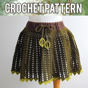 May include: A crochet skirt with a brown waistband and green crocheted details. The skirt has a lace-like pattern and a scalloped hem.