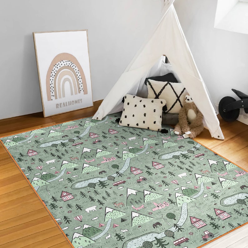 May include: A green and white play mat with a repeating pattern of mountains, trees, and houses. The mat is perfect for a playroom or nursery.