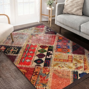 May include: A colorful patchwork rug with a distressed, vintage look. The rug features a variety of geometric patterns and colors, including red, blue, green, and yellow. The rug is made of wool and has a fringe border.
