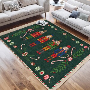 May include: A green rug with a Christmas theme featuring five nutcracker figurines, candy canes, and peppermint candies. The rug has a white and red striped border.