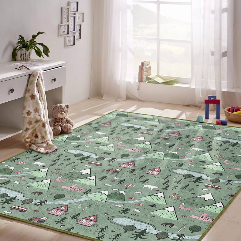 May include: A green and pink play rug with a repeating pattern of mountains, trees, houses, and animals. The rug is perfect for a child's playroom or bedroom.