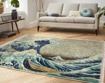 May include: A rug with a vintage-style print of the Great Wave off Kanagawa, a famous Japanese woodblock print by Hokusai. The rug features a large blue wave with white foam and a mountain in the background. The rug has a distressed, faded look, giving it a vintage feel.