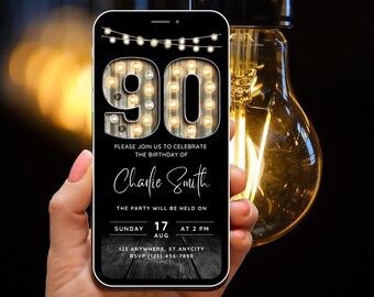 May include: A black and white digital invitation with a rustic wood background. The number 90 is displayed in a large, illuminated font with light bulbs. The text reads "Please join us to celebrate the birthday of Charlie Smith. The party will be held on Sunday, August 17 at 2 PM. 123 Anywhere, St. Anycity. RSVP (123) 456-7890."