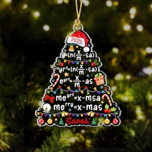 May include: A Christmas tree-shaped ornament with a red Santa hat that reads "2025". The ornament is decorated with mathematical equations, Christmas lights, and candy canes. The name "Sarah" is written at the bottom.