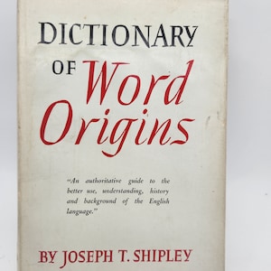 May include: A white book cover with the title "DICTIONARY OF Word Origins" in black and red lettering. The text below the title reads "An authoritative guide to the better use, understanding, history and background of the English language." and "BY JOSEPH T. SHIPLEY".
