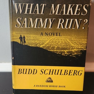 May include: A black and yellow paperback book titled "What Makes Sammy Run?" A Novel by Budd Schulberg. A Random House Book.