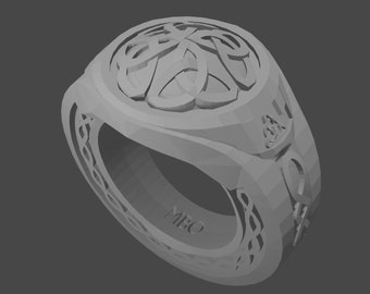 May include: A silver ring with a Celtic knot design on the top and a band with a Celtic knot pattern. The ring is engraved with the letters "MBO".