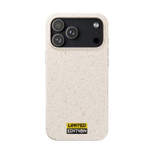 May include: A beige phone case with a speckled texture. The case has a black camera module with three lenses and a flash. The bottom right corner features a yellow and black "LIMITED EDITION" sticker with a smiling face.