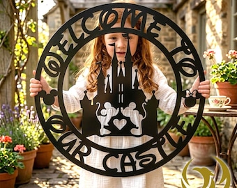 May include: Black metal welcome sign with a castle silhouette, Mickey and Minnie Mouse figures, and the words "WELCOME OUR CASTLE." The sign is circular and held by a person. The sign is suitable for outdoor or indoor use.