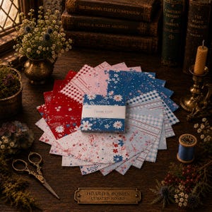 May include: A stack of square fabric swatches arranged in a fan pattern, featuring red, white, and blue floral, gingham, and star prints. A paper band labeled Firework Festival wraps the center. A metal plaque reads Hoard & Bobbin Curated Hoard.