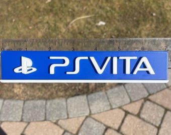 PSVITA logo Sign for Wall Display, Shelf Display, or Fridge Magnet - Comes with Magnets, 4 Stands, and Double-sided tape