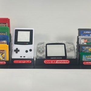 Multiple Game Boy Consoles and 18 Game display/stand Only (Black, White, Grey or Red)