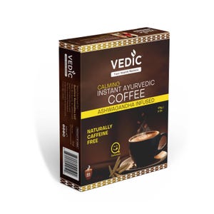 May include: A brown box with a gold border and the text "VEDIC" in white. The box contains calming instant Ayurvedic coffee infused with Ashwagandha. The coffee is naturally caffeine free and comes in a 109g/4 oz package.